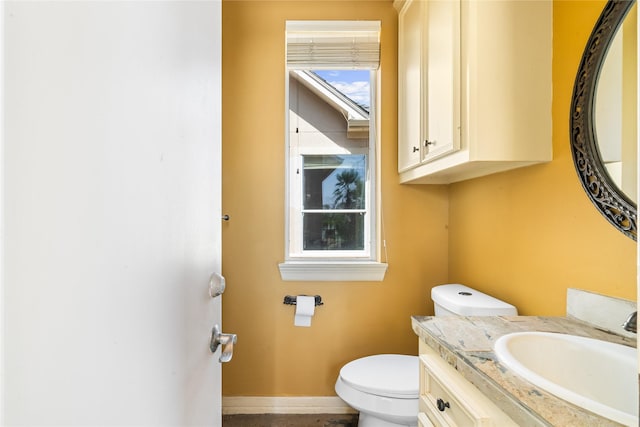 843 Royal Lakes Blvd, Richmond, TX 77469 - bathroom with vanity, toilet, and baseboards