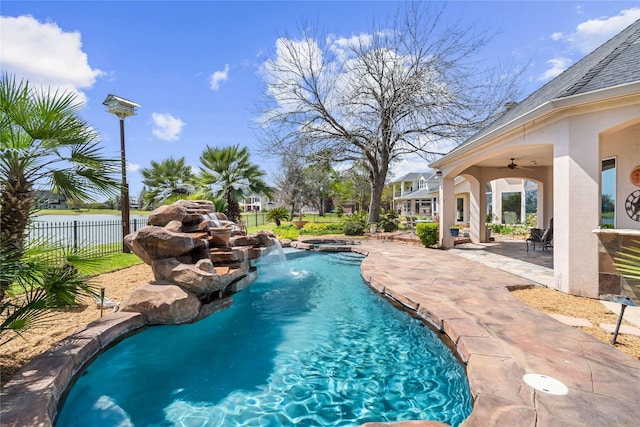 843 Royal Lakes Blvd, Richmond, TX 77469 - view of pool with a fenced in pool, fence, a patio area, an in ground hot tub, and a ceiling fan