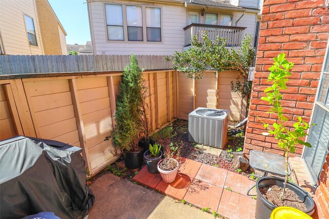2211 S Kirkwood Rd Unit 51, Houston, TX 77077 - exterior space featuring central air condition unit, fence, and a patio