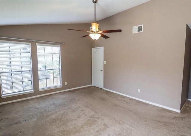 2211 S Kirkwood Rd Unit 51, Houston, TX 77077 - spare room featuring a ceiling fan, visible vents, vaulted ceiling, baseboards, and carpet flooring