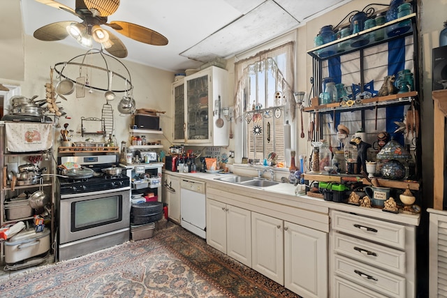 916 Sealy St, Galveston, TX 77550 - kitchen featuring a ceiling fan, a sink, light countertops, dishwasher, and stainless steel gas stove