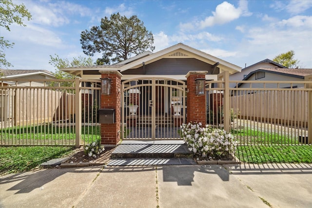 2615 White Oak Dr, Houston, TX 77009 - view of front of house with brick siding, a gate, and a fenced front yard