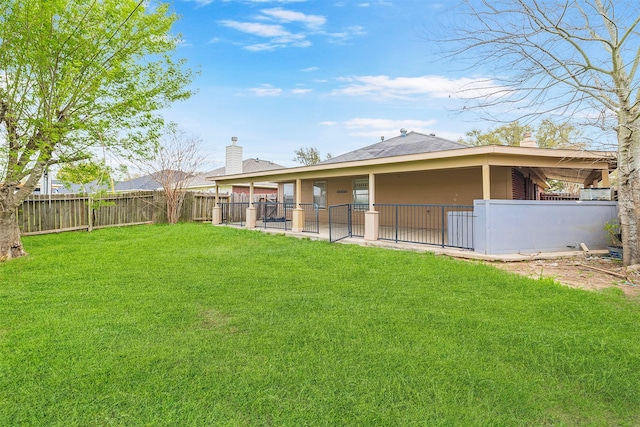 view of yard with a fenced backyard and a patio area
