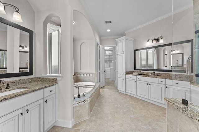 1038 Bolivar Point Ln, Friendswood, TX 77546 - bathroom featuring ornamental molding, a bath, and two vanities
