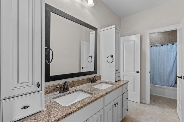 1038 Bolivar Point Ln, Friendswood, TX 77546 - bathroom with double vanity, shower / bath combo with shower curtain, and tile patterned floors