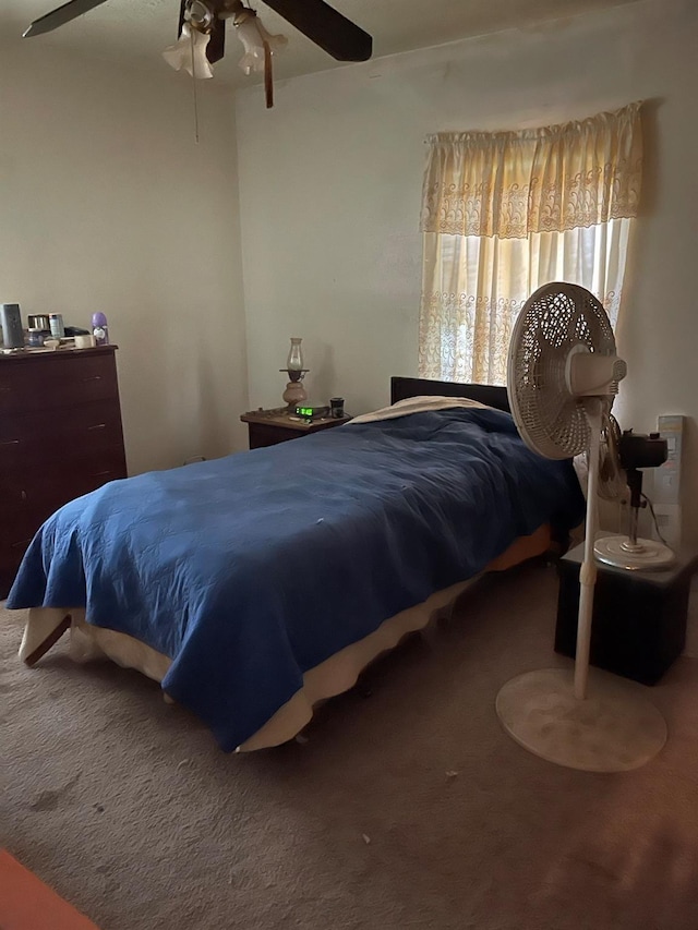 bedroom with carpet floors and a ceiling fan