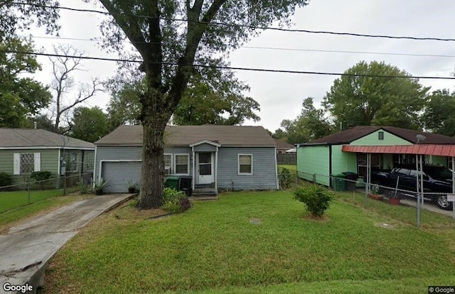 view of front of property with concrete driveway, a garage, fence, and a front lawn