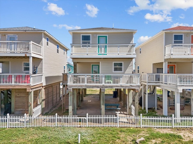 127 Howard, Surfside Beach, TX 77541 - back of property with a fenced backyard and a carport