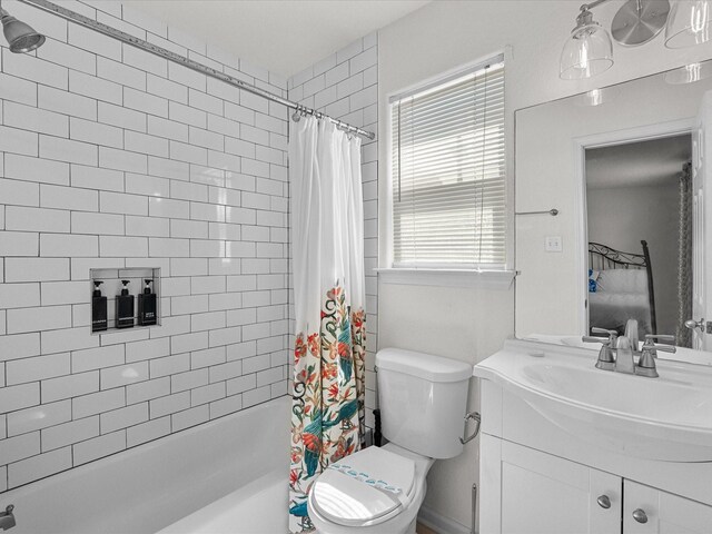 127 Howard, Surfside Beach, TX 77541 - bathroom featuring toilet, vanity, and shower / tub combo with curtain