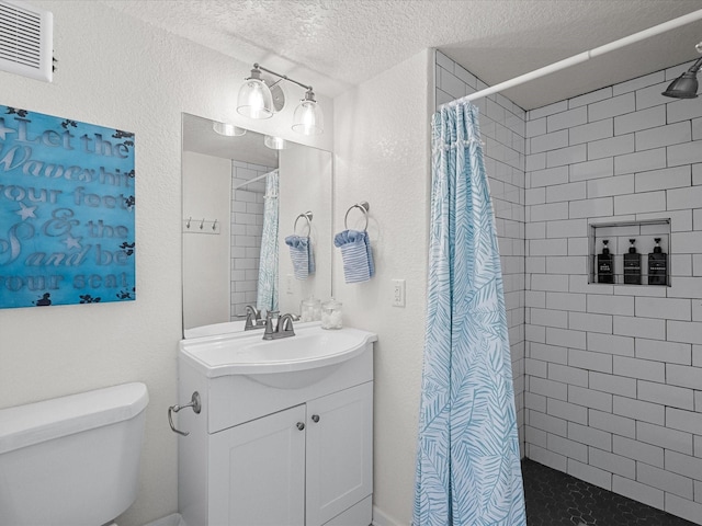 127 Howard, Surfside Beach, TX 77541 - bathroom with toilet, a textured ceiling, tiled shower, and visible vents