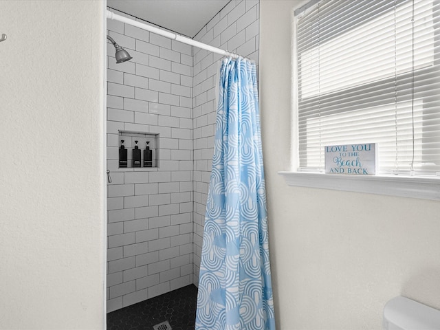 127 Howard, Surfside Beach, TX 77541 - bathroom with toilet and tiled shower