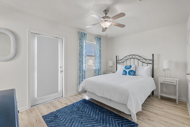 127 Howard, Surfside Beach, TX 77541 - bedroom with baseboards, a textured ceiling, light wood-style flooring, and ceiling fan