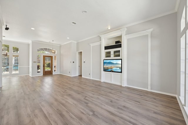 unfurnished living room with wood finished floors, recessed lighting, ornamental molding, and baseboards