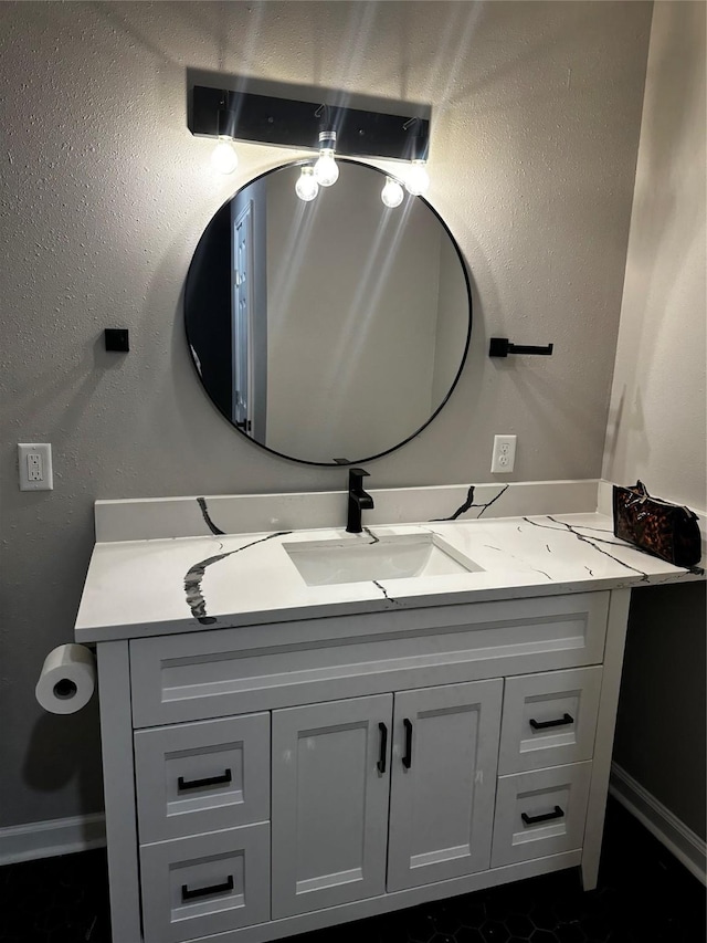 10525 Fairland Dr, Houston, TX 77051 - bathroom featuring baseboards, vanity, and a textured wall