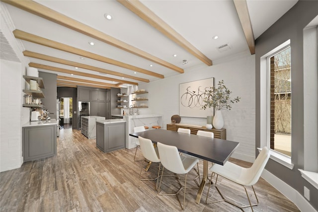 9219 Hummingbird Ln, Missouri City, TX 77459 - dining area featuring visible vents, baseboards, beam ceiling, light wood-style flooring, and recessed lighting