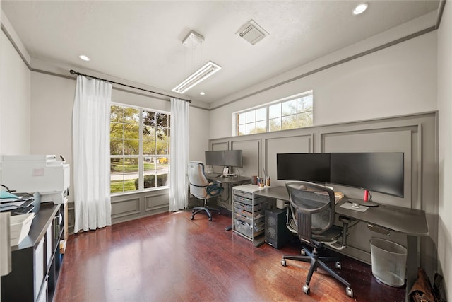 9219 Hummingbird Ln, Missouri City, TX 77459 - home office with visible vents, dark wood finished floors, ornamental molding, and a decorative wall