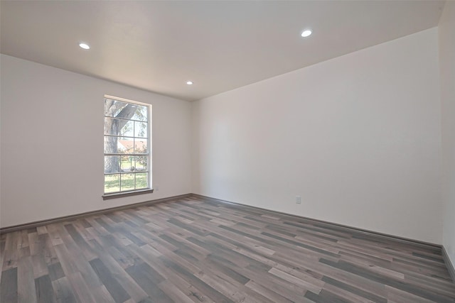 empty room featuring wood finished floors and recessed lighting