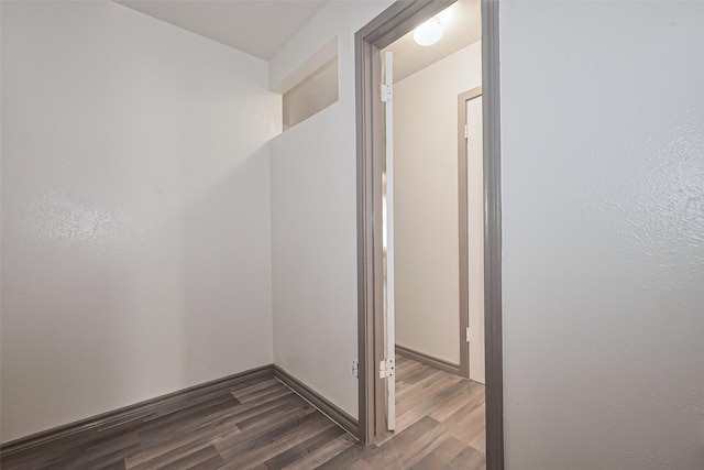 corridor with wood finished floors