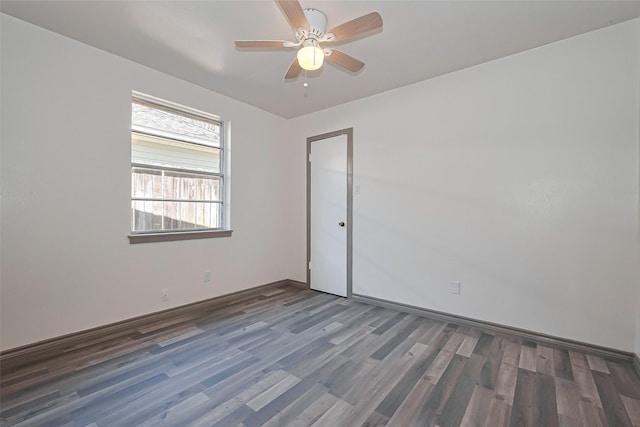empty room featuring ceiling fan and wood finished floors