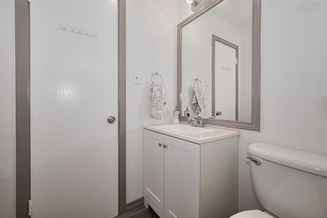bathroom with toilet and vanity