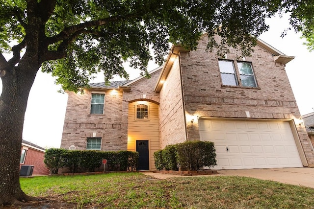 30615 S Sulphur Creek Dr, Magnolia, TX 77355 - view of front of property featuring brick siding, driveway, cooling unit, and an attached garage