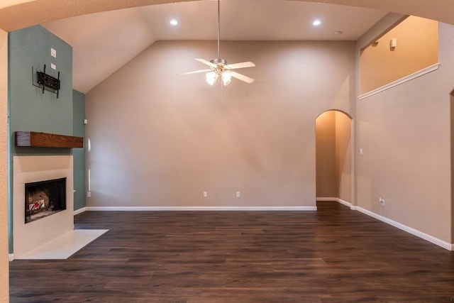 30615 S Sulphur Creek Dr, Magnolia, TX 77355 - unfurnished living room with arched walkways, ceiling fan, dark wood finished floors, recessed lighting, and a fireplace with flush hearth