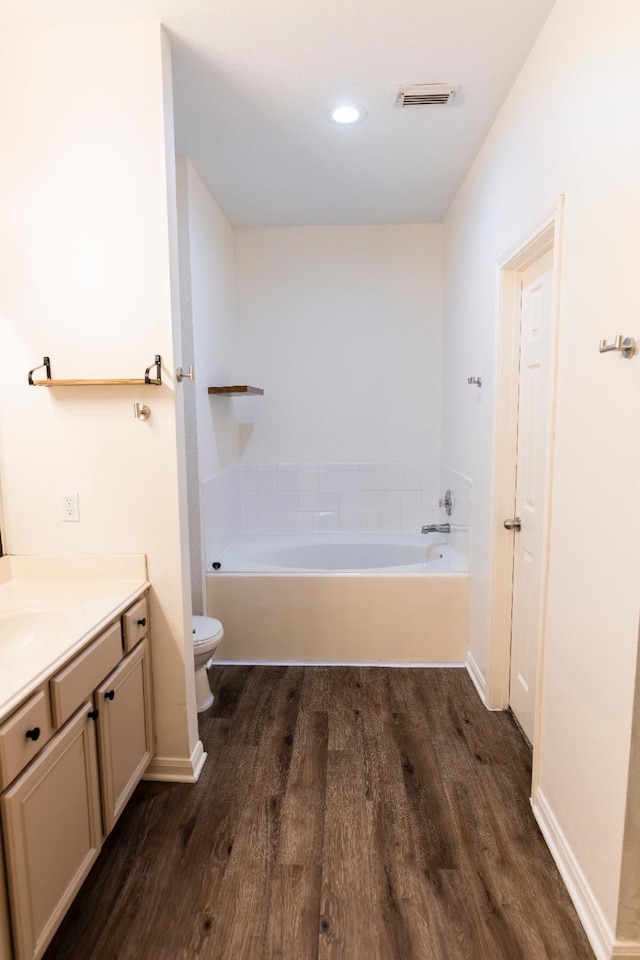 30615 S Sulphur Creek Dr, Magnolia, TX 77355 - bathroom featuring a bath, vanity, visible vents, toilet, and wood finished floors
