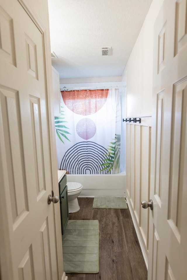 30615 S Sulphur Creek Dr, Magnolia, TX 77355 - bathroom featuring vanity, shower / tub combination, toilet, visible vents, and wood finished floors
