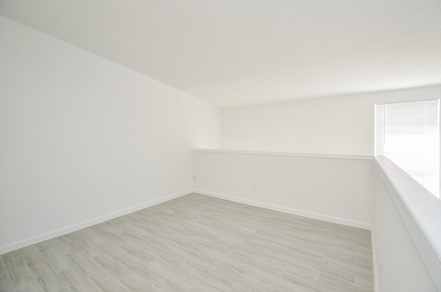 10501 S Dr Unit 300, Houston, TX 77099 - empty room with light wood-style flooring and baseboards