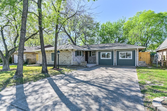 7119 Lumber Jack Dr, Houston, TX 77040 - view of front of property with concrete driveway and brick siding