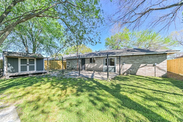 7119 Lumber Jack Dr, Houston, TX 77040 - rear view of property with a patio area and brick siding