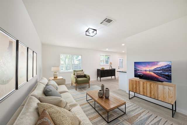 7119 Lumber Jack Dr, Houston, TX 77040 - living area featuring light wood finished floors, recessed lighting, and baseboards