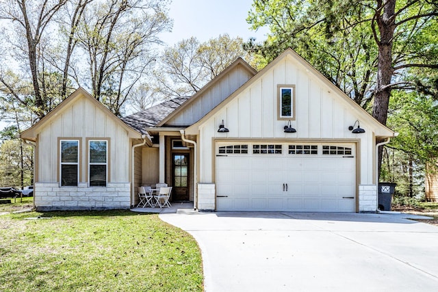 modern farmhouse with board and batten siding, an attached garage, and concrete driveway