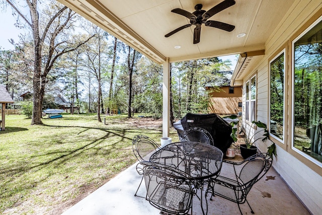 view of patio / terrace featuring outdoor dining area and ceiling fan