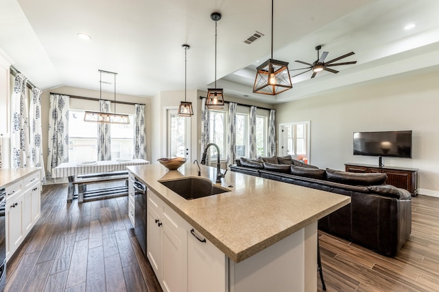 kitchen featuring a sink, dark wood finished floors, white cabinets, and a wealth of natural light