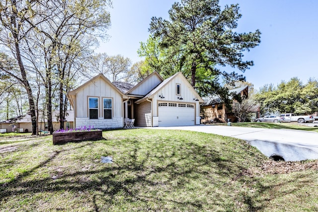 view of front of property with a front lawn, stone siding, board and batten siding, an attached garage, and driveway