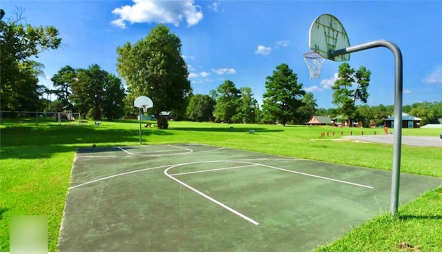 view of sport court featuring a yard and community basketball court