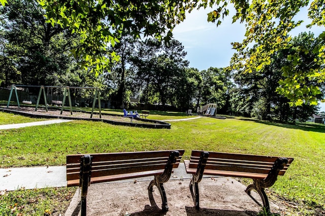 view of community featuring a yard and playground community