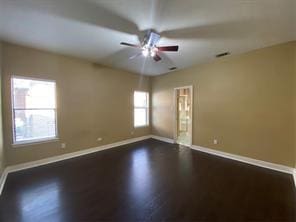 14959 Royal Birkdale St, Houston, TX 77095 - unfurnished room with visible vents, dark wood-style floors, baseboards, and ceiling fan