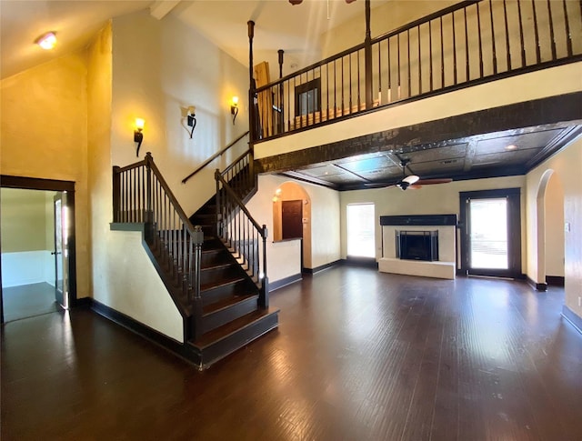 14959 Royal Birkdale St, Houston, TX 77095 - unfurnished living room with baseboards, arched walkways, and ceiling fan