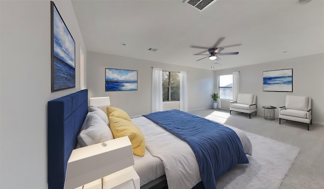 bedroom with visible vents, ceiling fan, carpet, and baseboards