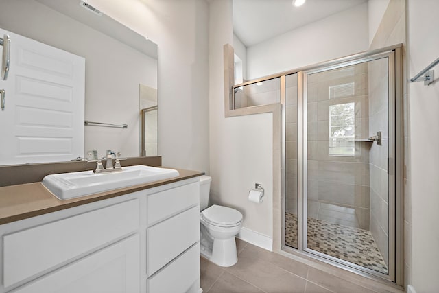 4411 Windy Oaks Dr, Fulshear, TX 77441 - bathroom featuring toilet, a shower stall, vanity, and tile patterned floors