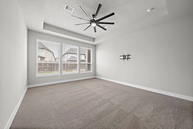 4411 Windy Oaks Dr, Fulshear, TX 77441 - carpeted spare room featuring a raised ceiling, baseboards, and ceiling fan