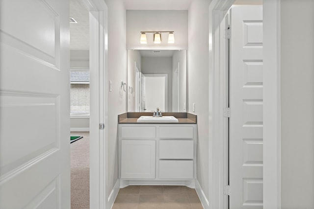 4411 Windy Oaks Dr, Fulshear, TX 77441 - bathroom with vanity, tile patterned floors, and baseboards