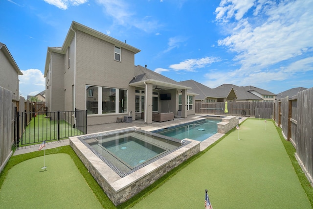 4411 Windy Oaks Dr, Fulshear, TX 77441 - view of swimming pool featuring an area to practice putting, an in-ground hot tub, a ceiling fan, and a patio