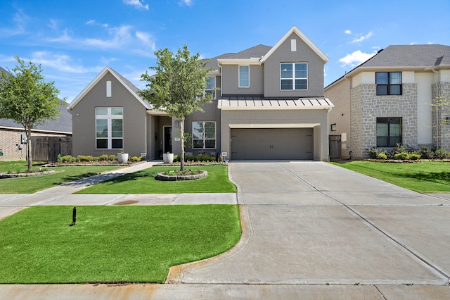 4411 Windy Oaks Dr, Fulshear, TX 77441 - view of front of house with concrete driveway, an attached garage, and a standing seam roof