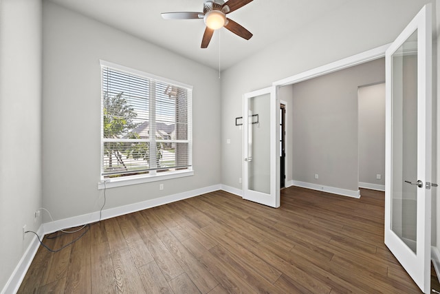 4411 Windy Oaks Dr, Fulshear, TX 77441 - unfurnished bedroom with french doors, dark wood-style floors, baseboards, and ceiling fan