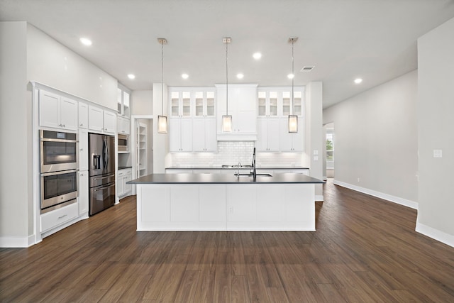 4411 Windy Oaks Dr, Fulshear, TX 77441 - kitchen featuring appliances with stainless steel finishes, a sink, a large island, white cabinetry, and recessed lighting