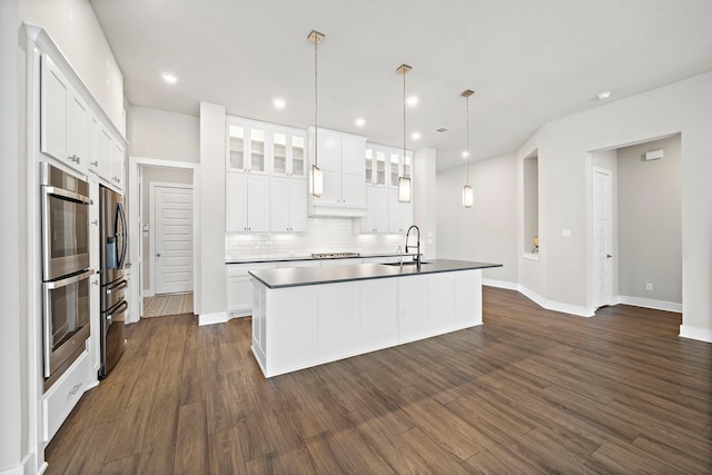 4411 Windy Oaks Dr, Fulshear, TX 77441 - kitchen with stainless steel appliances, a sink, backsplash, dark wood-style floors, and recessed lighting