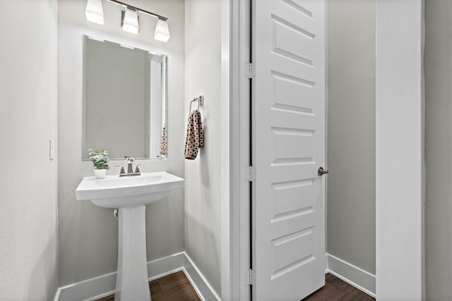 4411 Windy Oaks Dr, Fulshear, TX 77441 - bathroom featuring baseboards and wood finished floors